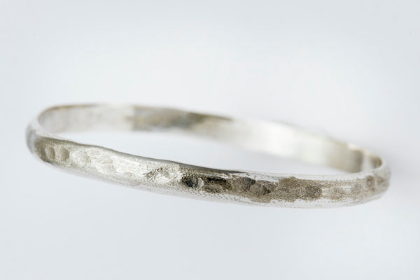 Hand beaten silver bangle