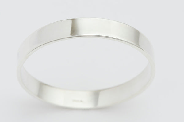 Flat profile closed bangle. Width 10mm.