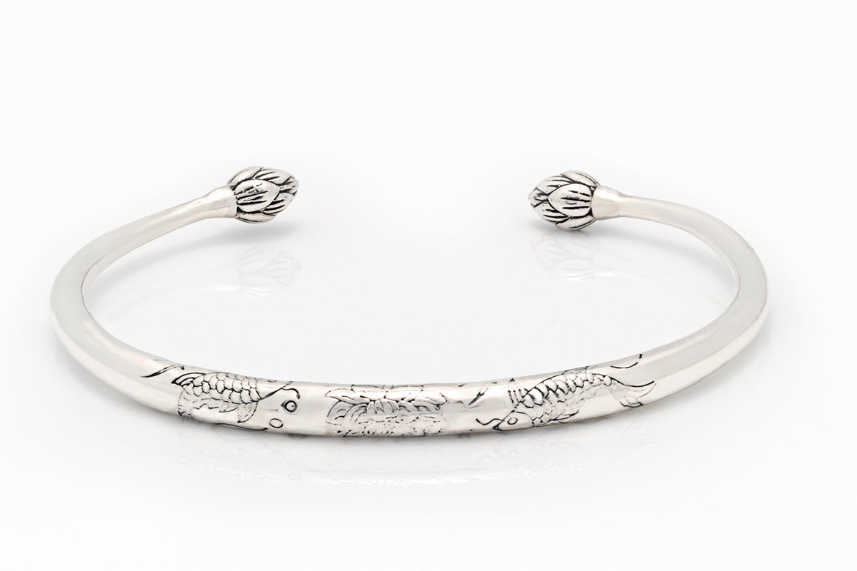 Silver bangle engraved torc design with lotus flower ends