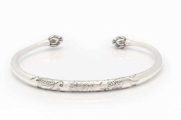 Silver bangle - engraved torc design with lotus flower ends